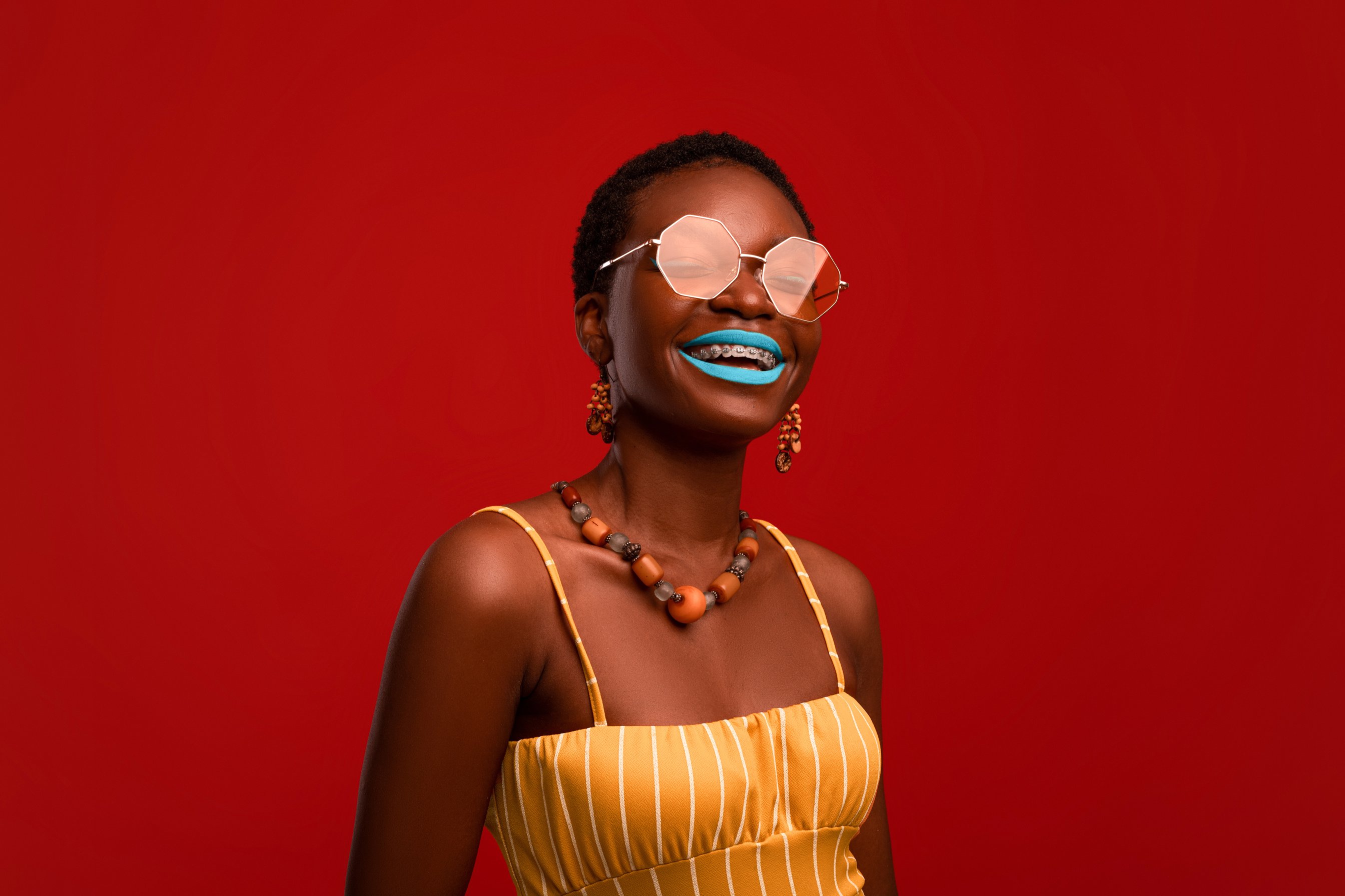 Happy Attractive Black Woman in Sunglasses and Summer Outfit